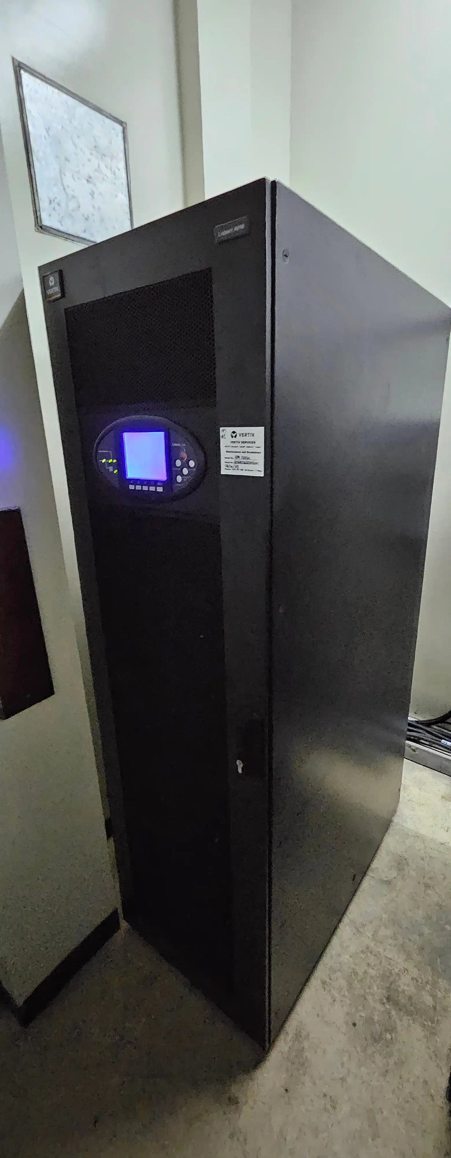 UPS Runtime & Battery Calculator | UPS Battery Sizing, black cabinet with illuminated display panel