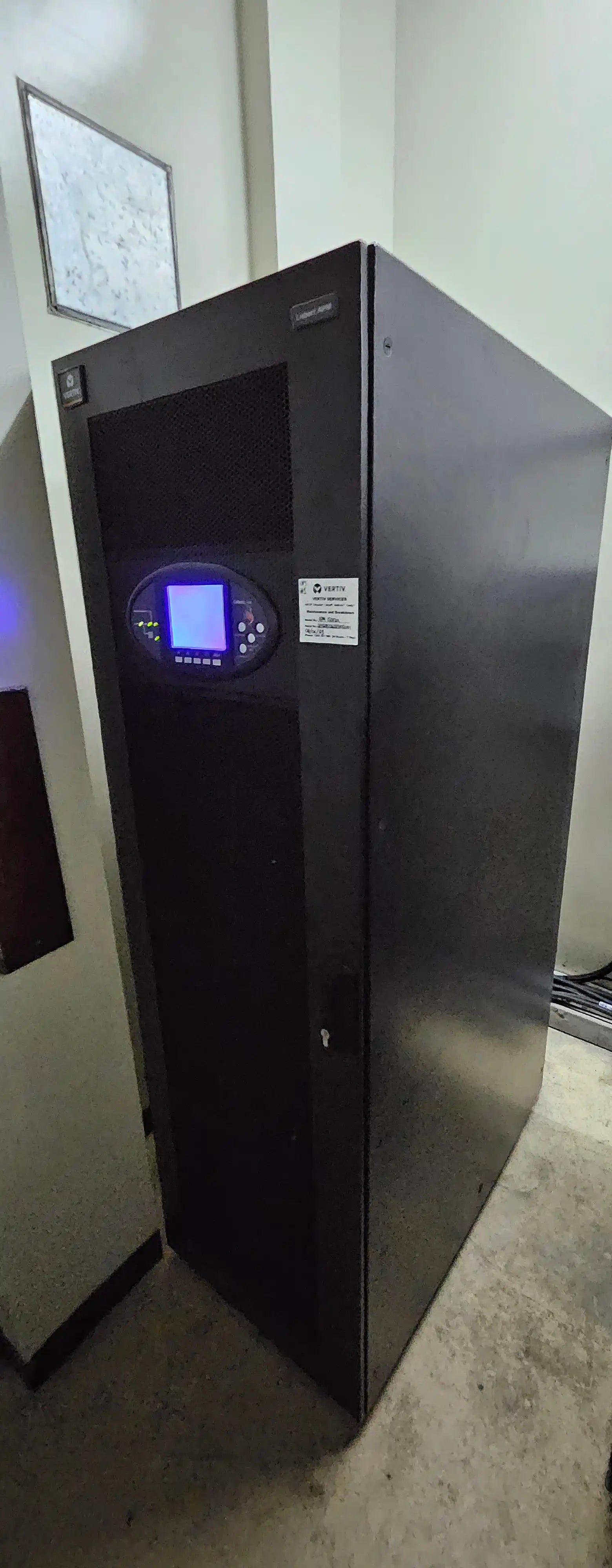 UPS Runtime & Battery Calculator | UPS Battery Sizing, black cabinet with illuminated display panel