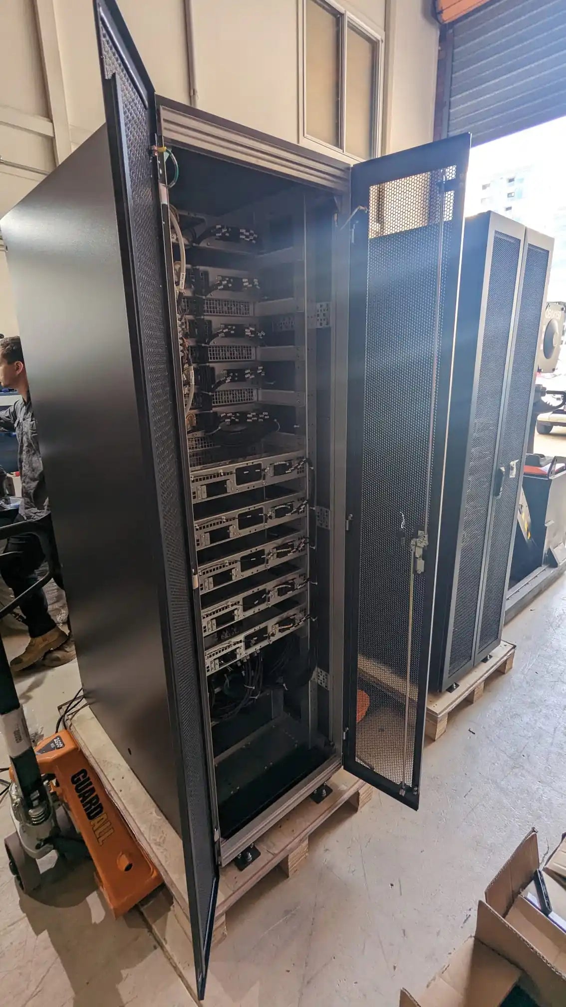 UPS Runtime & Battery Calculator | UPS Battery Sizing, open cabinet showing internal electronic modules
